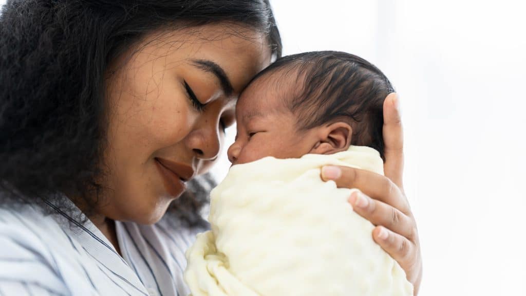 mother holding newborn baby