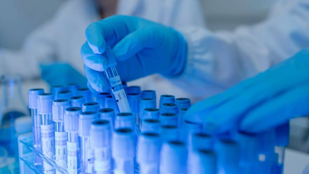 lab worker holding a test tube