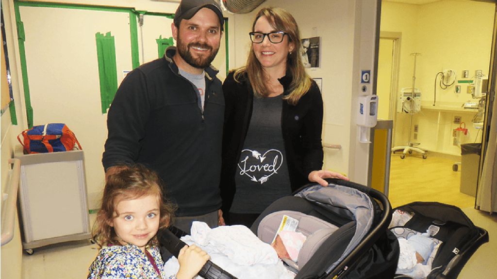 Krysten Lawrence Milk Bank Recipient, standing with her family.